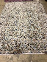 A Kashan pale green ground carpet, 310 x 207cm