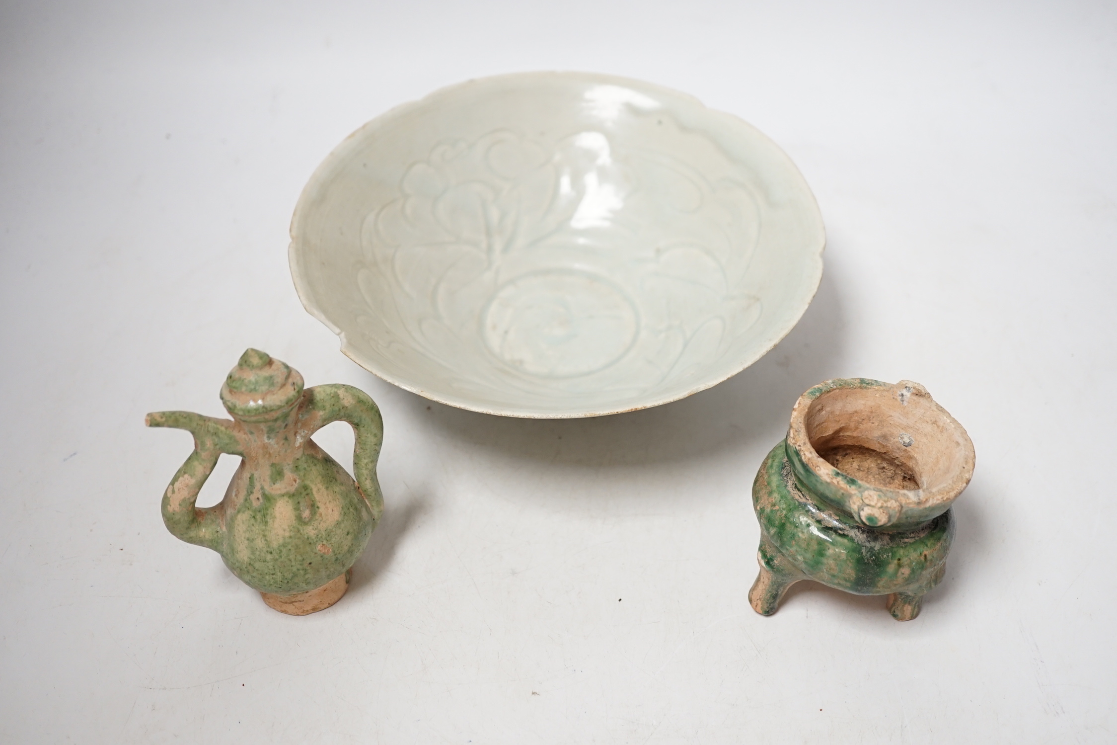 A Chinese incised Qingbai bowl, Song Dynasty and two green glazed Ming Dynasty pottery models of - Image 2 of 7