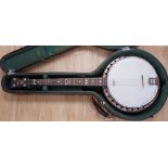 A cased English 1930s Windsor Whirl four string tenor banjo, mother of pearl inlaid neck, length