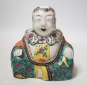 A Chinese enamelled porcelain figure of Budai, late 18th/early 19th century, 18cm high