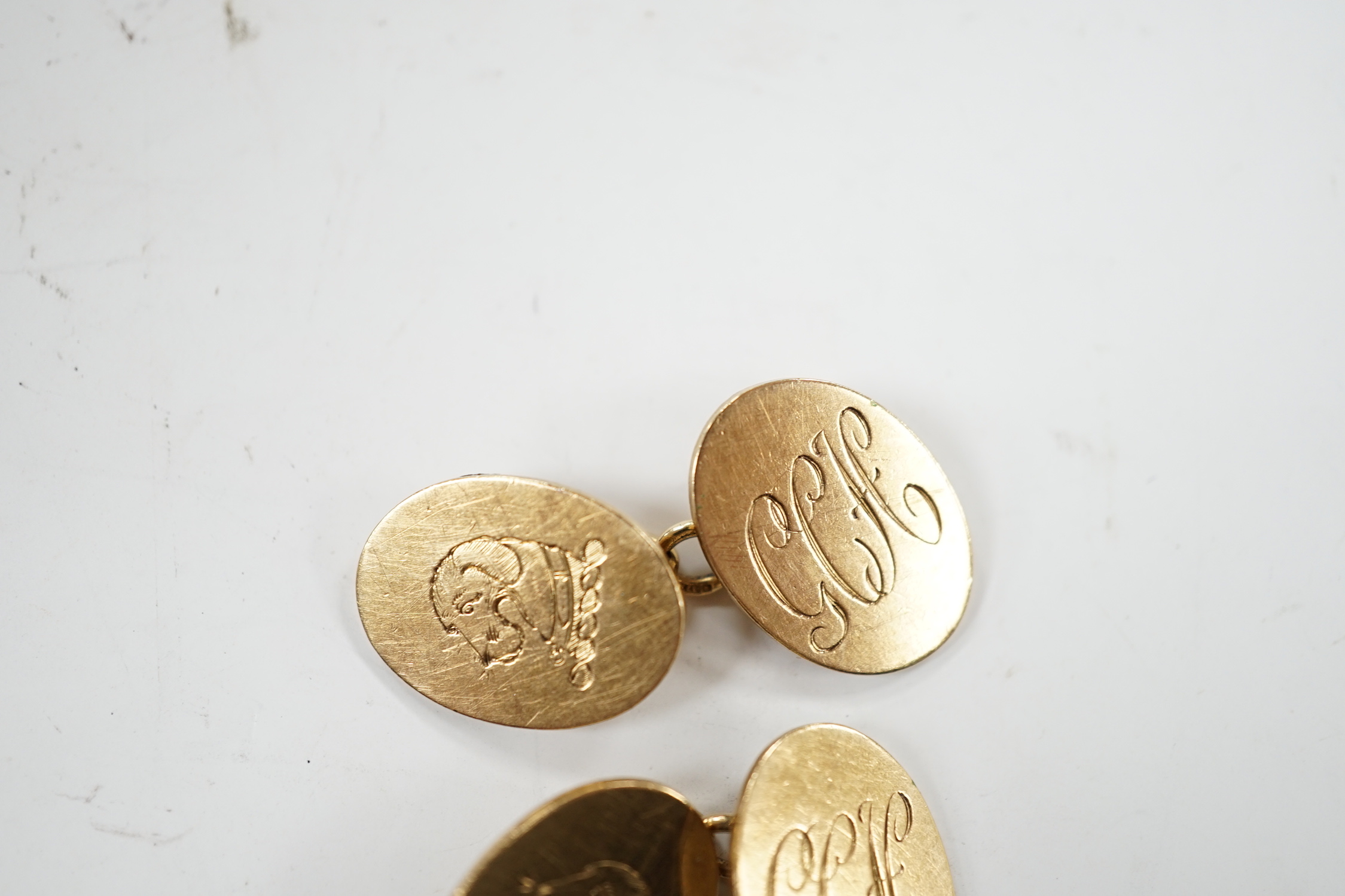 A pair of early 1960's 9ct gold oval cufflinks, with engraved crest and monogram, 10.3 grams. - Image 2 of 10