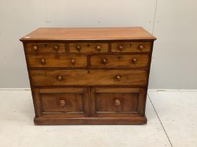 A Victorian mahogany chest fitted with an arrangement of seven drawers, width 110cm, depth 52cm,