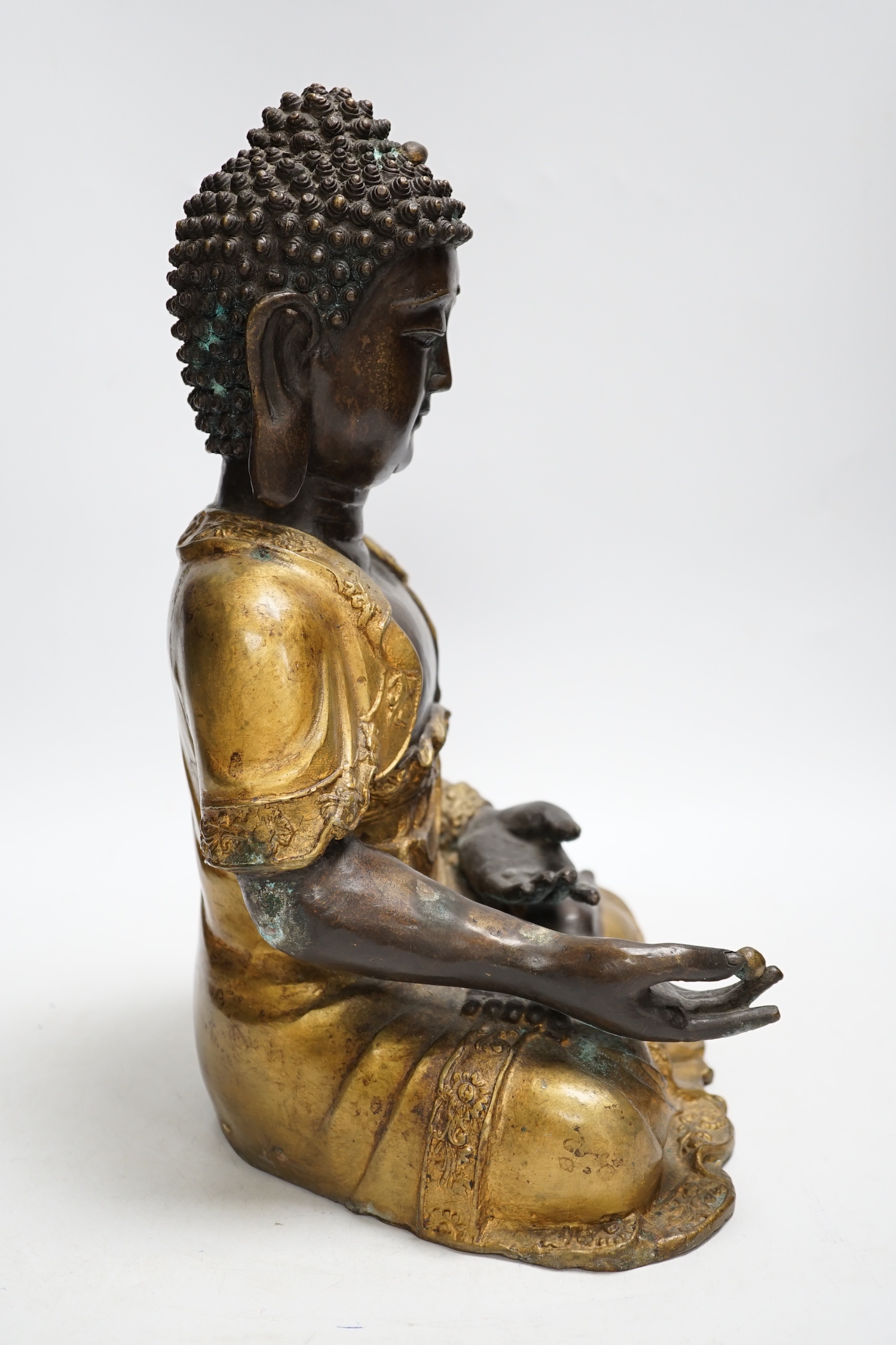 A gilt bronze seated Buddha, 35cm high - Image 3 of 4