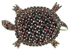 A late Victorian gold plated and pave set garnet tortoise brooch, 41mm.