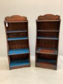 A pair of Regency style painted simulated rosewood narrow open bookcases, width 50cm, depth 31cm,