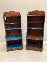 A pair of Regency style painted simulated rosewood narrow open bookcases, width 50cm, depth 31cm,
