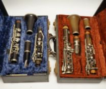 Two cased unmarked clarinets with early key systems, one mid 19th century in rosewood, one with