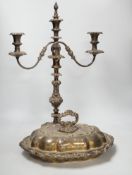 A silver plated entree dish and cover and a pair of three light candelabra, tallest 55cm
