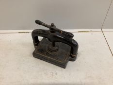 A Victorian cast iron book press, width 42cm, height 30cm