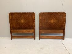 A pair of Art Deco coromandel banded burr walnut single headboards, width 92cm, height 100cm