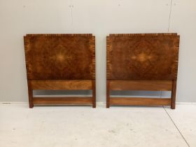 A pair of Art Deco coromandel banded burr walnut single headboards, width 92cm, height 100cm