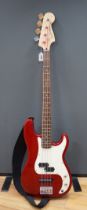 Squire by Fender, a Precision bass guitar with Torque T303MT amplifier