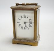 An early 20th century French lacquered brass carriage timepiece, cased, 11cm high
