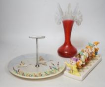 A quantity of mixed ceramics and glass including a Disney style toast rack, a Lurpak toast rack,