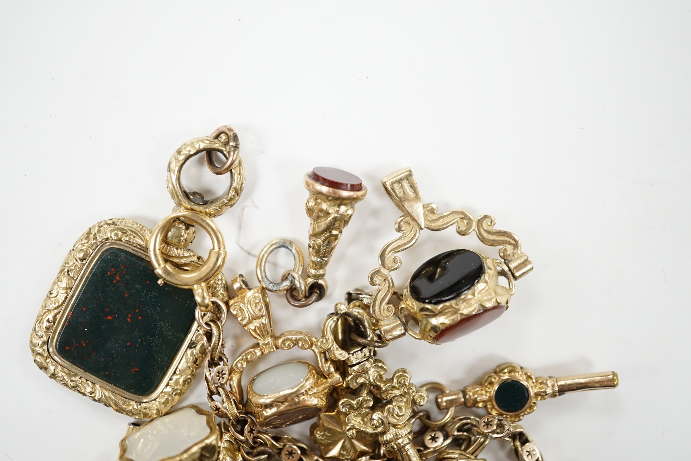 An early 20th century yellow metal charm bracelet (a.f.), hung with five assorted watch keys, - Image 2 of 4