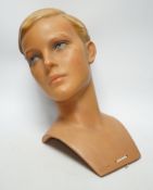 An Imans, Paris, plaster mannequin shop display head of a boy, 30cm high