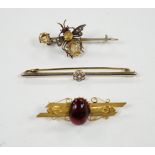 An Edwardian 15ct and diamond cluster set bar brooch, 60mm and two other gem set bar brooches