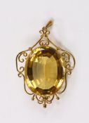 A yellow metal mounted oval cut citrine pendant, overall 56mm, gross weight 15.8 grams.