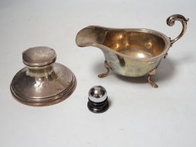 A 1930's silver sauceboat a silver mounted inkwell and one other item.