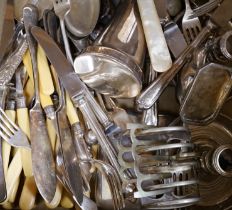 A group of assorted plated flatware