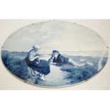Three late 19th/early 20th century Delft oval landscape plaques, 45cm