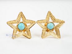 A pair of yellow metal and single stone turquoise set star earrings, 15mm, gross weight 2.4 grams.