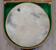 An Irish Bodhran drum with Celtic decorated plywood frame and goat skin, diameter 46cm, in fitted