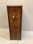 An early 20th century oak four drawer filing cabinet, width 45cm, depth 71cm, height 135cm