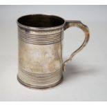 A Victorian reeded silver christening mug, Edward Charles Brown, London, 1868, 94mm.