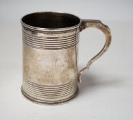 A Victorian reeded silver christening mug, Edward Charles Brown, London, 1868, 94mm.