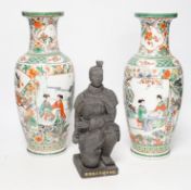A pair of 20th century Chinese famille verte vases and a figure, tallest 31cm