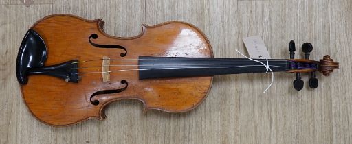 An uncased early 20th century violin, length of body 35.5cm