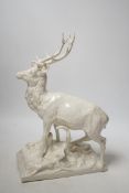A Nymphenburg white glazed porcelain model of a stag, 31cm high