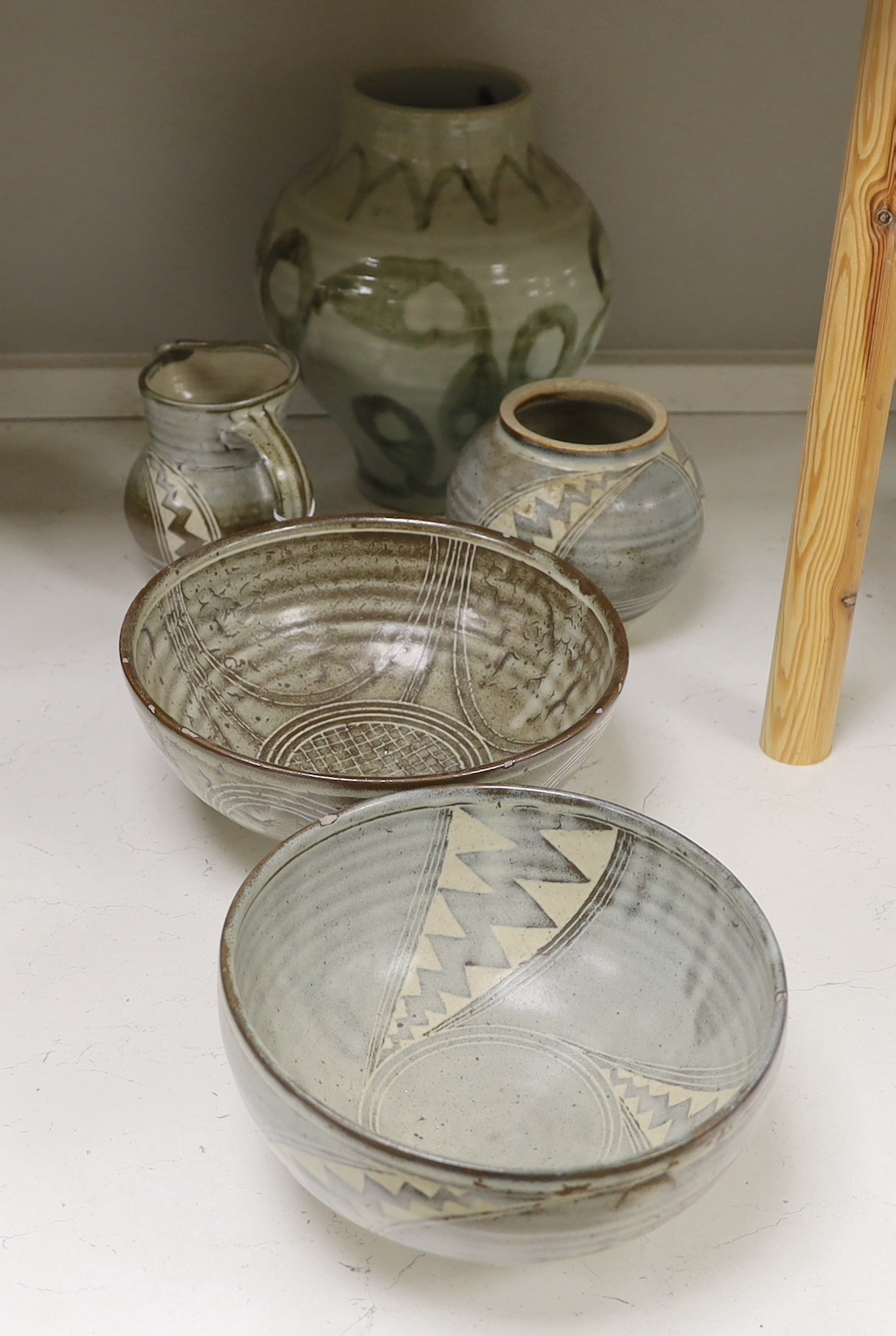 A 1961 Studio pottery vase and two bowls, a Studio pottery 'Gloucester' vase and a jug, largest 28cm