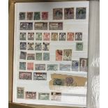 A collection of stamps arranged in albums including Great Britain, Ceylon and Nigeria