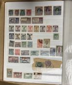 A collection of stamps arranged in albums including Great Britain, Ceylon and Nigeria
