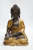 A gilt bronze seated Buddha, 35cm high