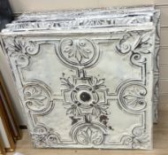 A group of nine decorative pressed tin panels made from salvaged antique tin ceilings, 59cm sq.