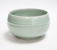 A Chinese celadon glazed pot, 8cm high