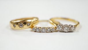 A late Victorian 18ct gold and gypsy set three stone diamond chip ring and two other 18ct and