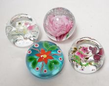 Four lampwork glass flower paperweights, Phoenix, 10/50, Caithness 199/250 and 194/250 and
