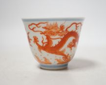 A Chinese iron red enamelled ‘dragon’ tea bowl, 5cm high