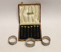A cased set of six sterling and enamel cocktail sticks, with cockerel terminals and three silver