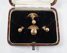 A cased mid 20th century 9ct gold four piece dress stud set, 4.2 grams.
