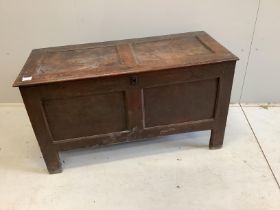 An 18th century panelled oak coffer, width 111cm, depth 47cm, height 62cm