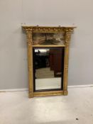 A Regency gilt wood and composition pier glass with painted landscape frieze, width 61cm, height