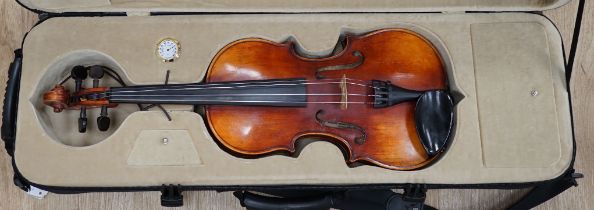 A Czechoslovakian student’s violin with Stradivarius label inside the body, length of body, 35.