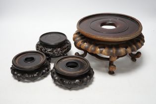 Four Chinese 19th/early 20th century rosewood stands, tallest 10.5cm high