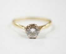 A modern 18ct gold and illusion set solitaire diamond ring, size M/N, gross weight 2.1 grams.