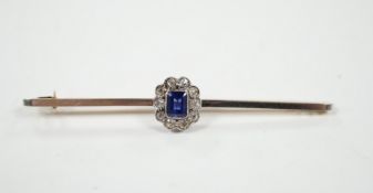 An early 20th century 15ct and plat, sapphire and diamond oval cluster set bar brooch, 64mm, gross
